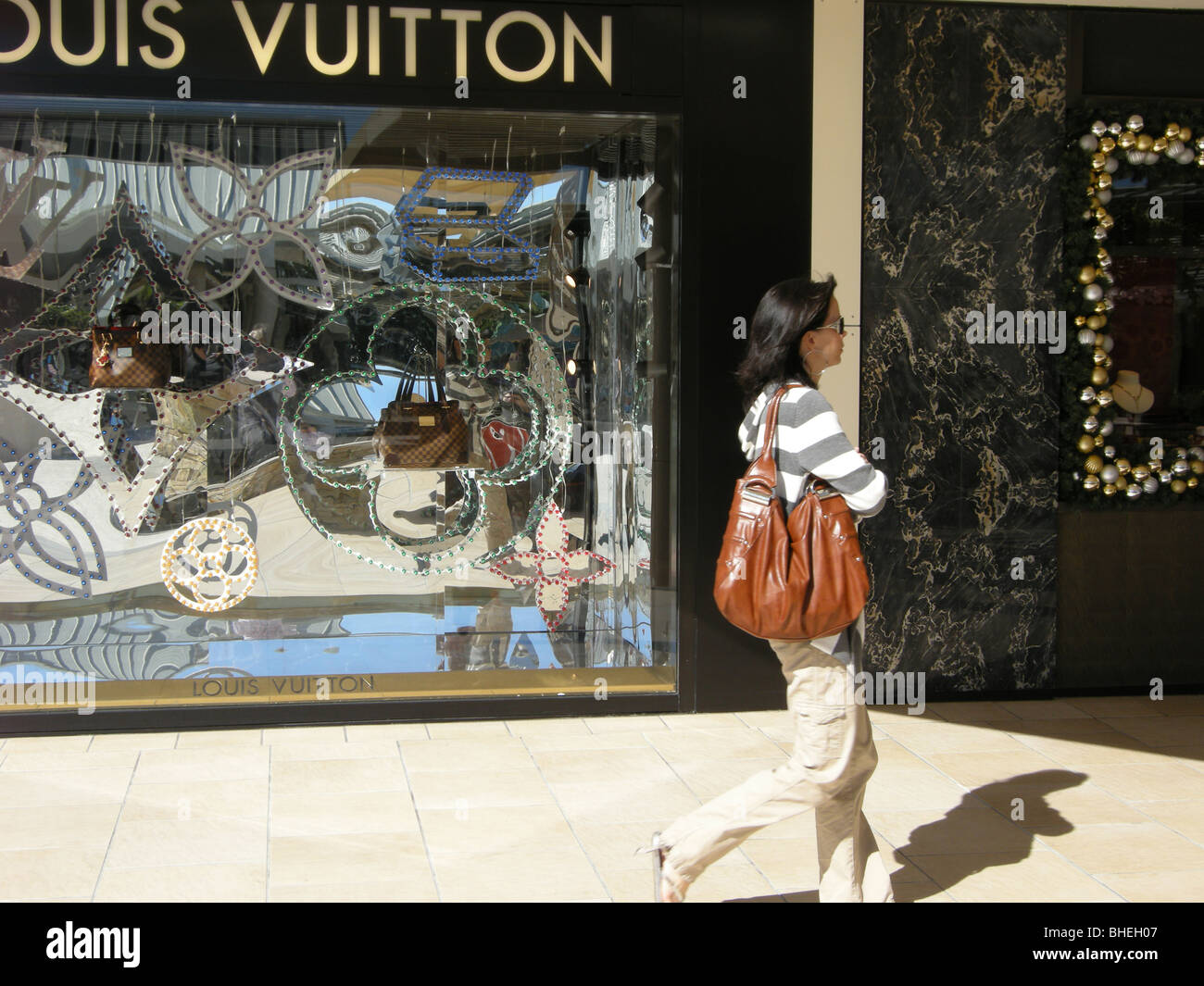 Girl shopping in front of Louis Vuitton at Waterside shops Naples Florida  USA Stock Photo - Alamy