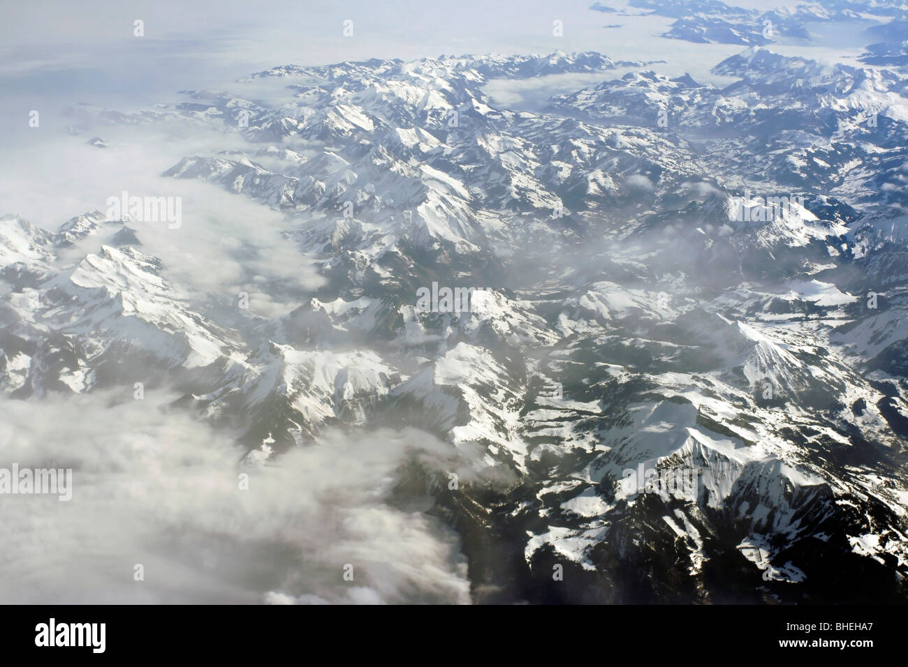 Aerial view of the Alps at 40,000 feet from an airplane. Stock Photo