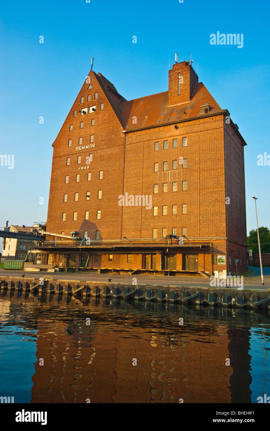 Depository warehouses at harbor of Demmin along Peene river, Mecklenburg-Western Pomerania, Germany Stock Photo