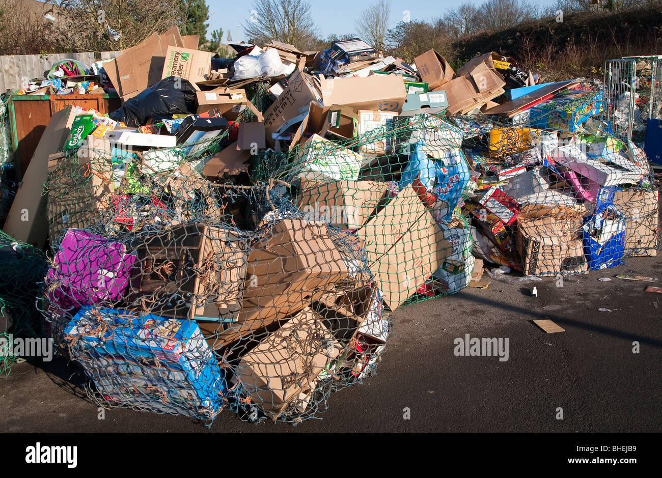 Cardboard waste at recycling collection station in car par UK Stock