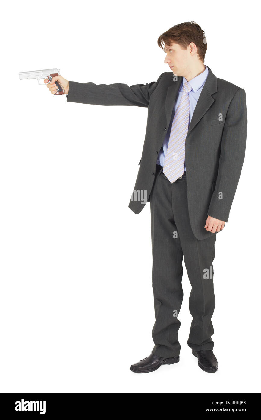 Businessman aiming a gun, isolated on a white background Stock Photo