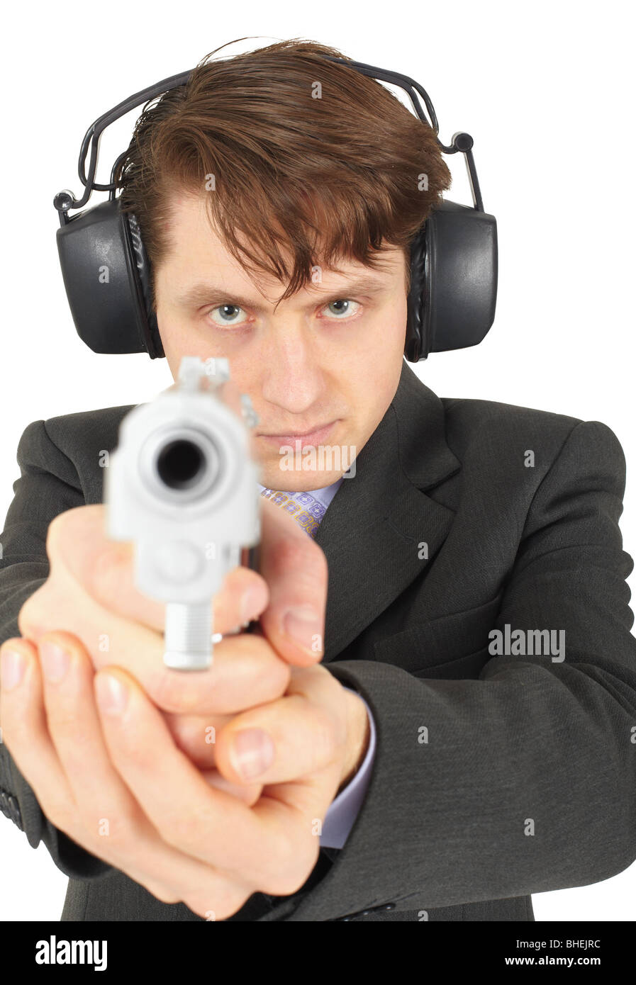 Businessman aiming a gun, isolated on a white background Stock Photo