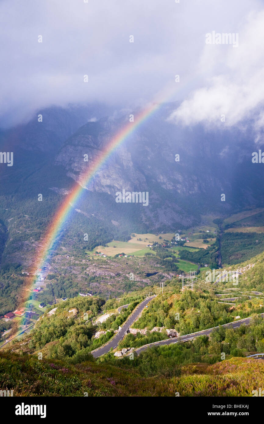 Rainbow over a valley Lysebotn. Norway Stock Photo