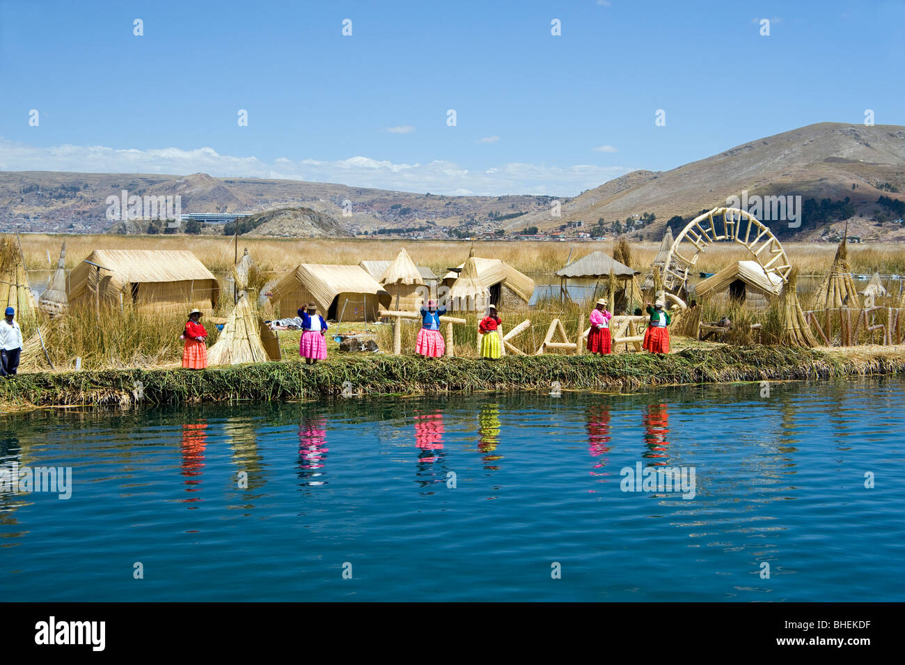Uros islanders looking for trade from passing tourist boats, Lake Titicaca, Peru Stock Photo