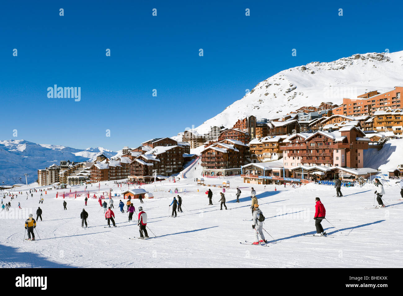 Skiers on the slopes in the centre of the resort of Val Thorens, Three Valleys, Tarentaise, Savoie, France Stock Photo