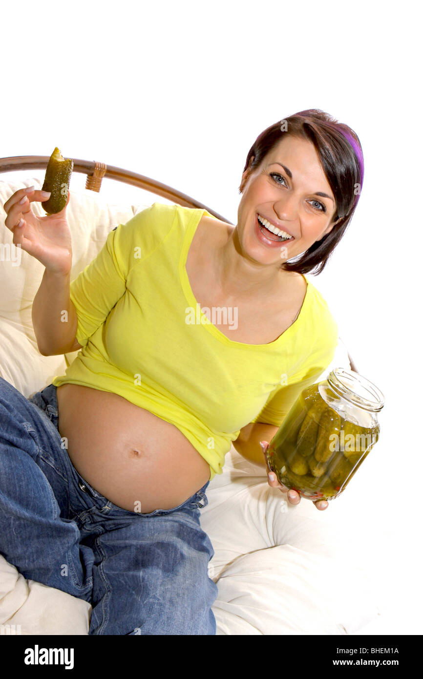 Pregnant woman eating pickles Stock Photo Alamy