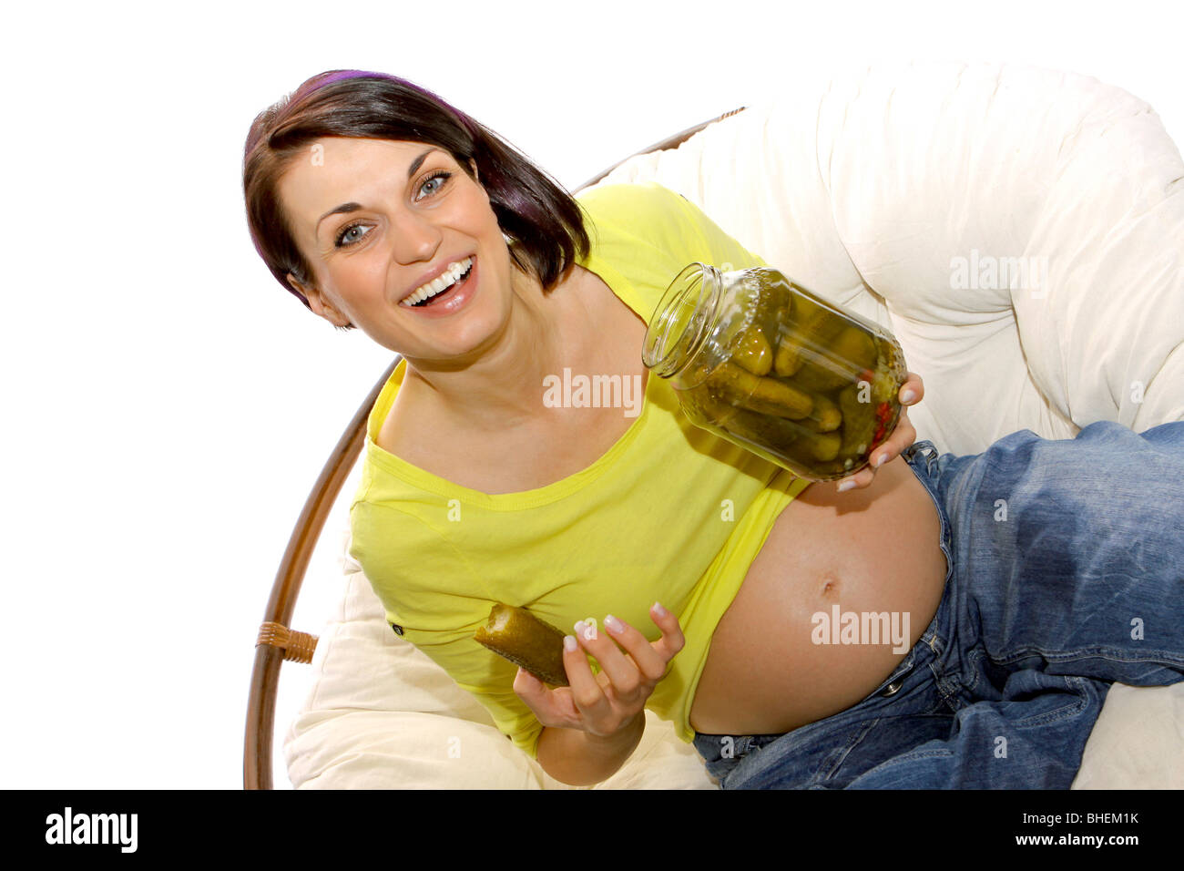 Pregnant woman eating pickles Stock Photo Alamy