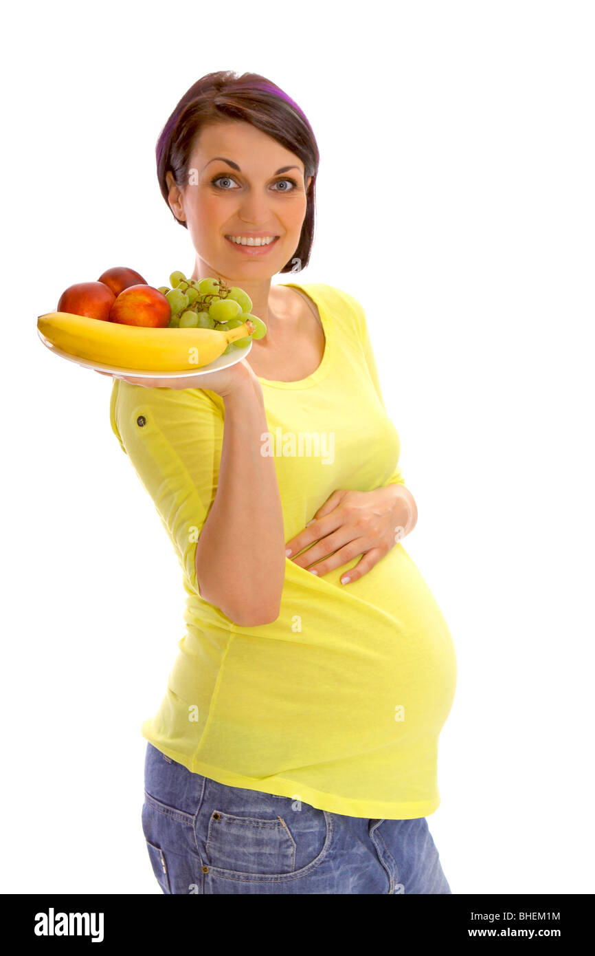 Pregnant woman with fresh fruits Stock Photo - Alamy