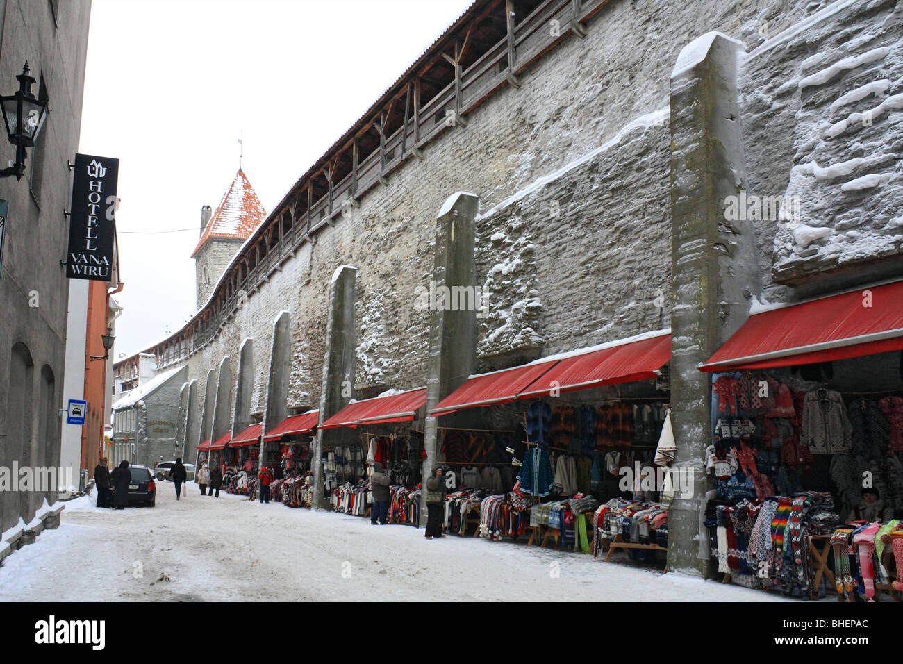 The markets stalls beneath the stone wall of the Old Town, Tallinn, Estonia. Stock Photo