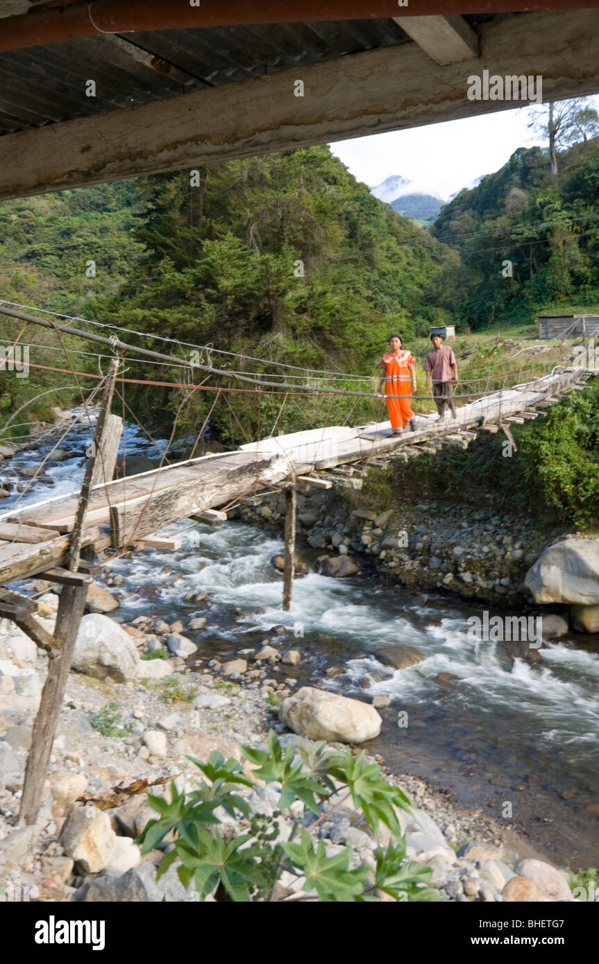 Two people crossing suspension bridge hi-res stock photography and ...