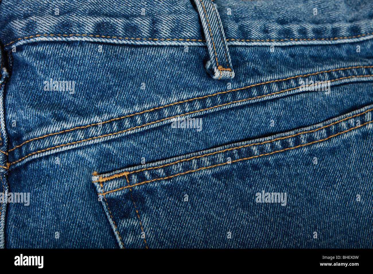 A closeup of stitched denim blue jeans Stock Photo