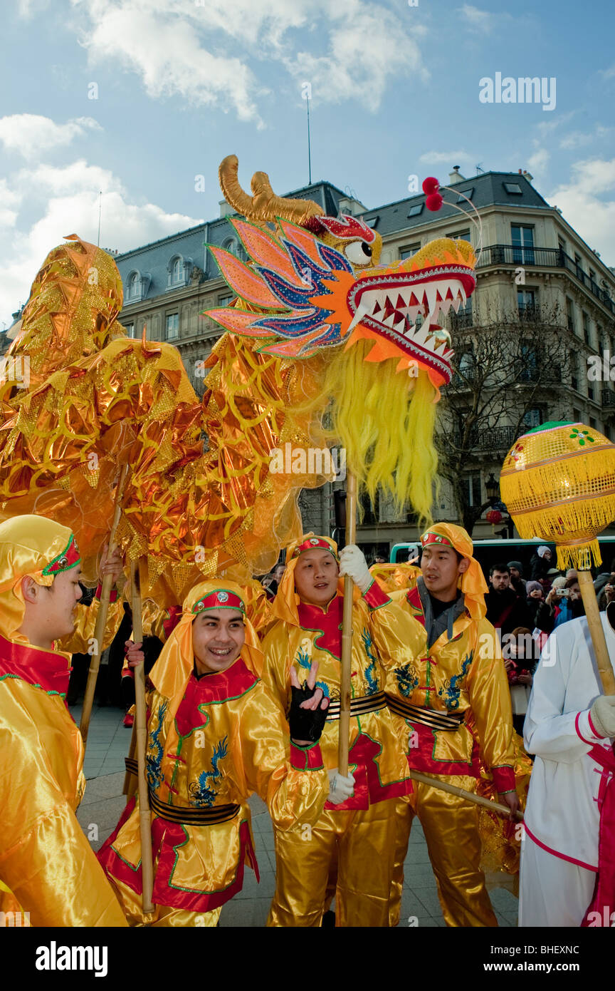 Paris, France,  multiracial group People, Asian men Celebrating 'Chinese New year' Annual Street Carnival Parade, Chinese Dragon Dance Stock Photo