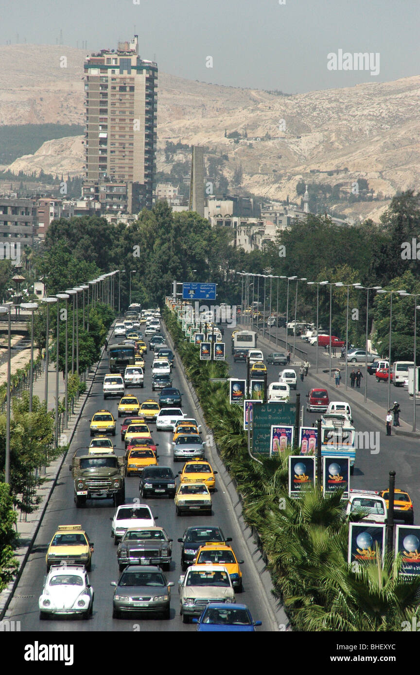Cars, traffic and pedestrians on a highway in downtown Damascus, with