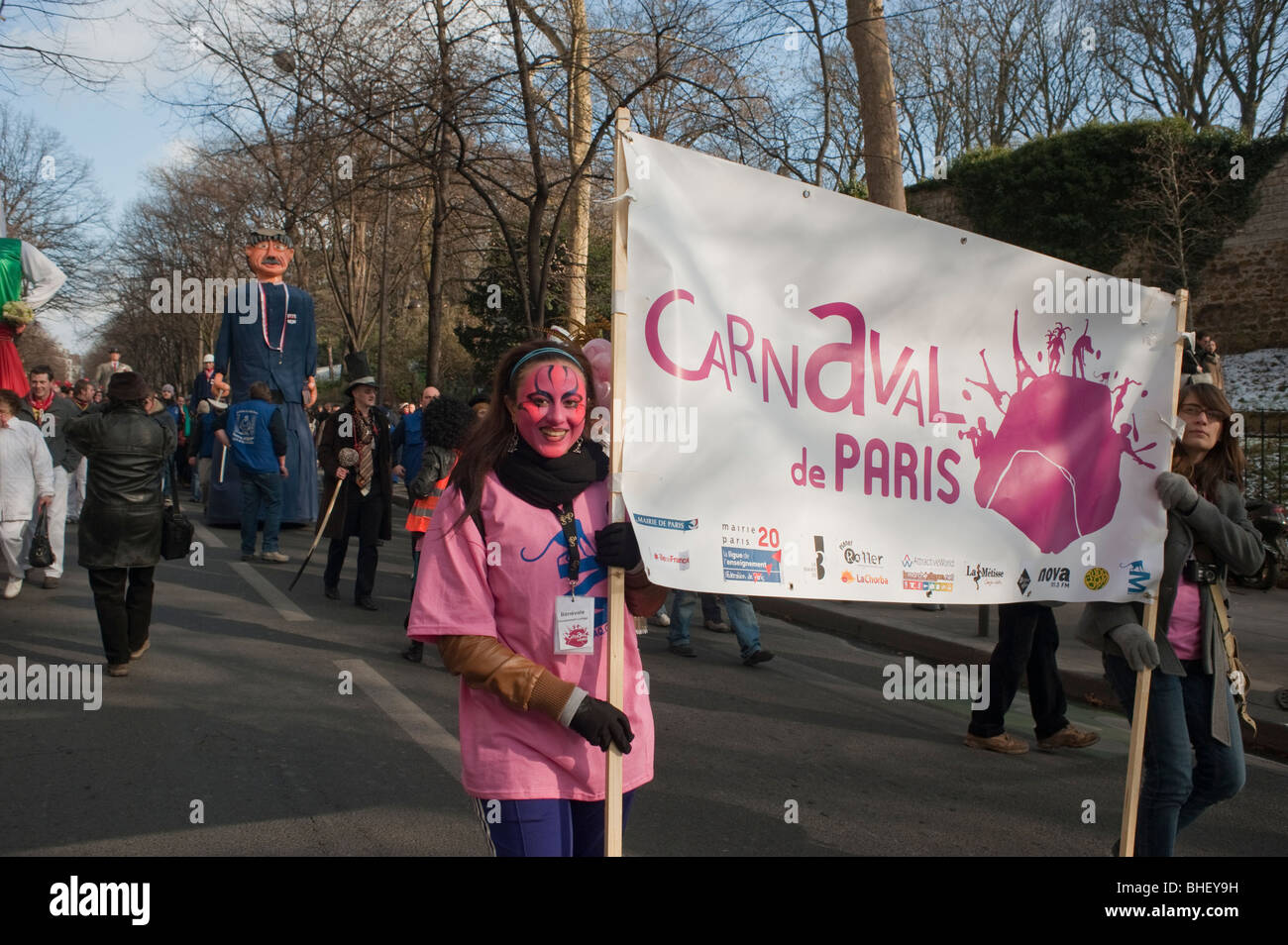 Paris, France, People in Costume Marching in 'Carnaval de Paris' Paris Carnival Street Festival, Women Holding Sign, Customs and traditions France Stock Photo