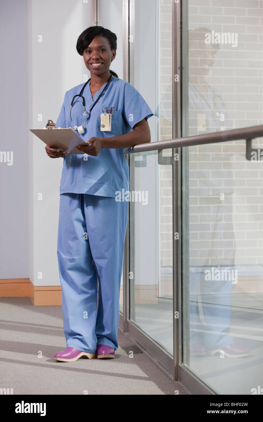 Portrait of a female nurse holding a clipboard Stock Photo - Alamy