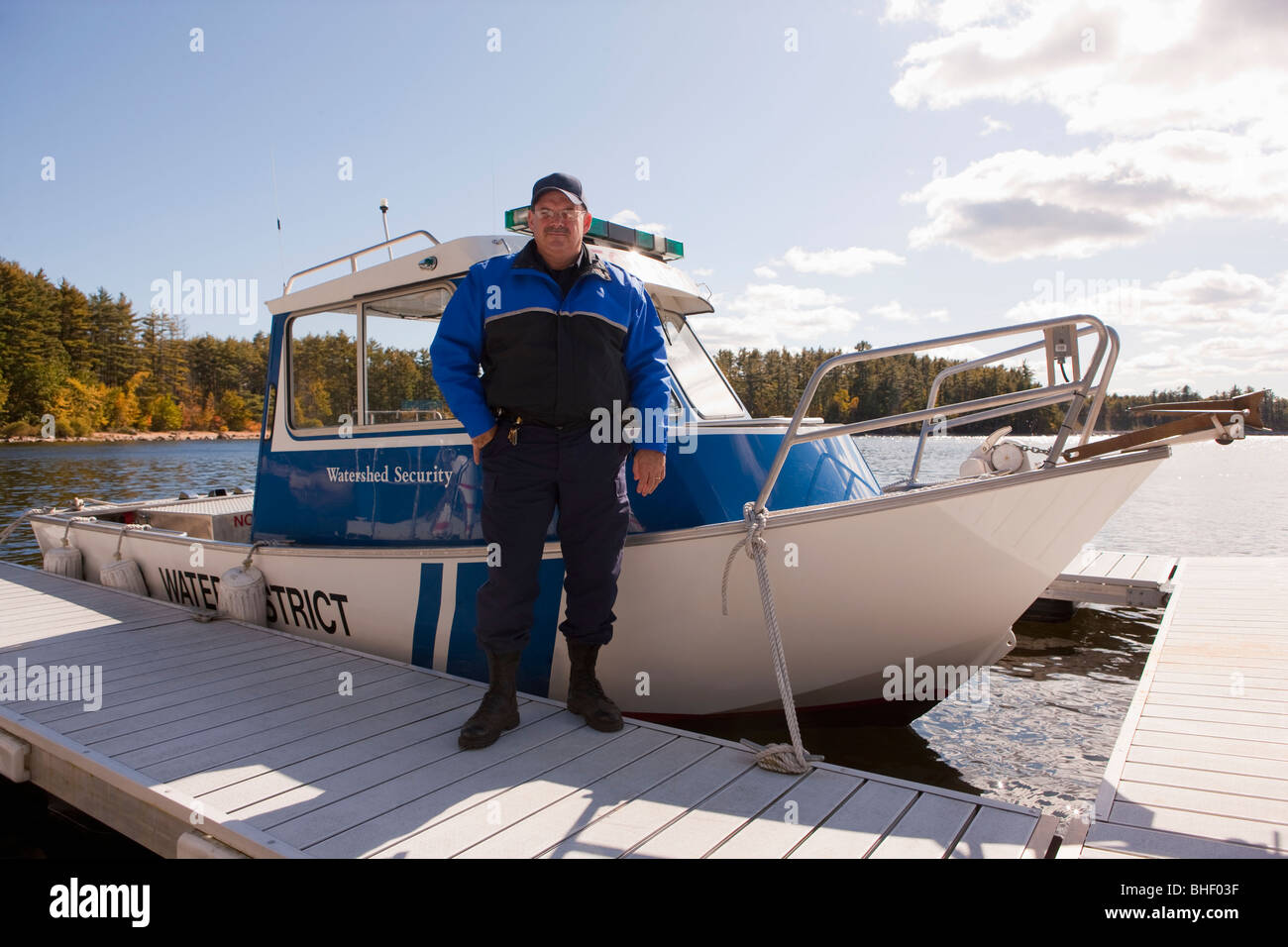 Security guard standing at a dock Stock Photo Alamy