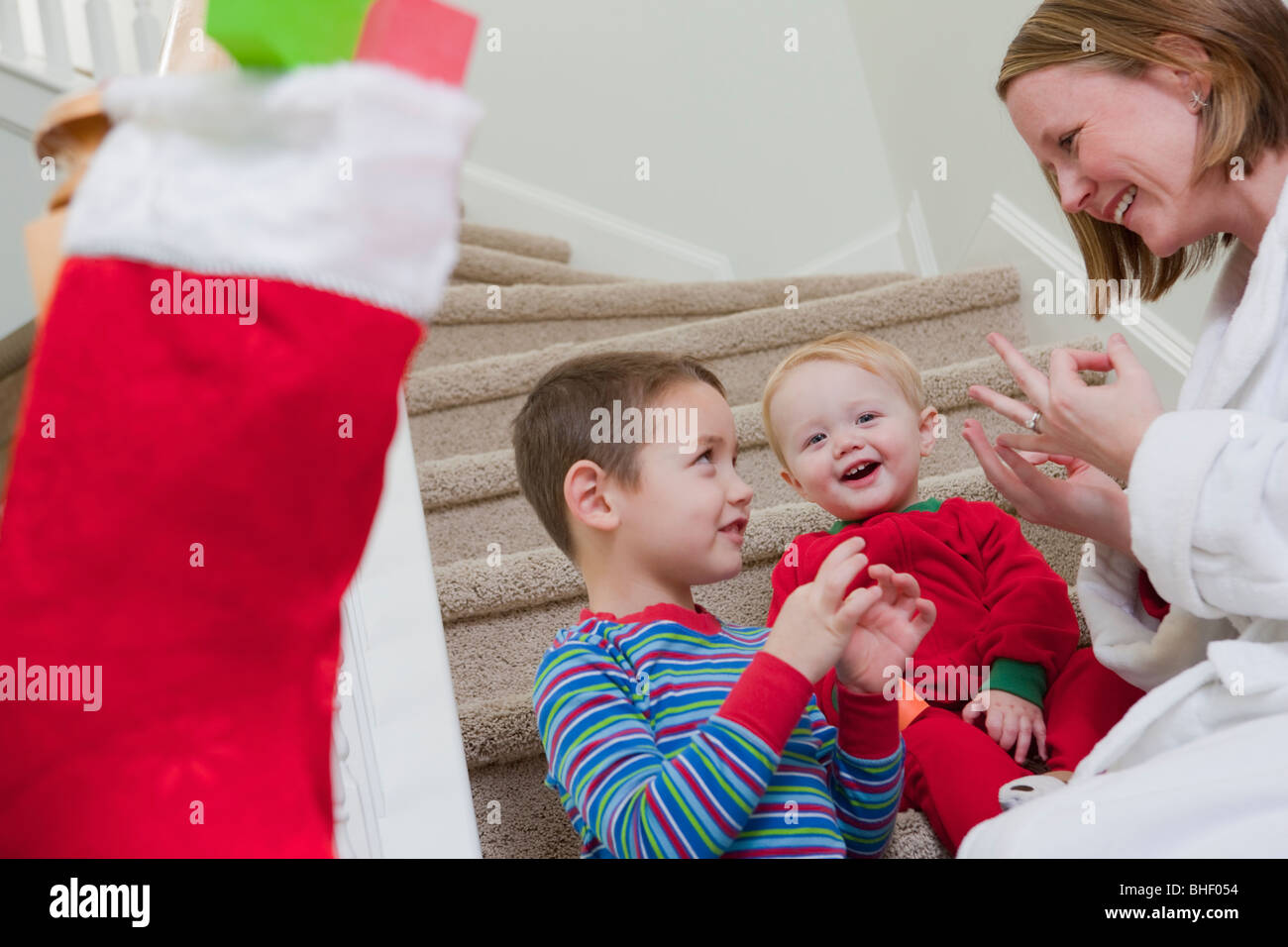 Woman signing the word 'Family' in American Sign Language while