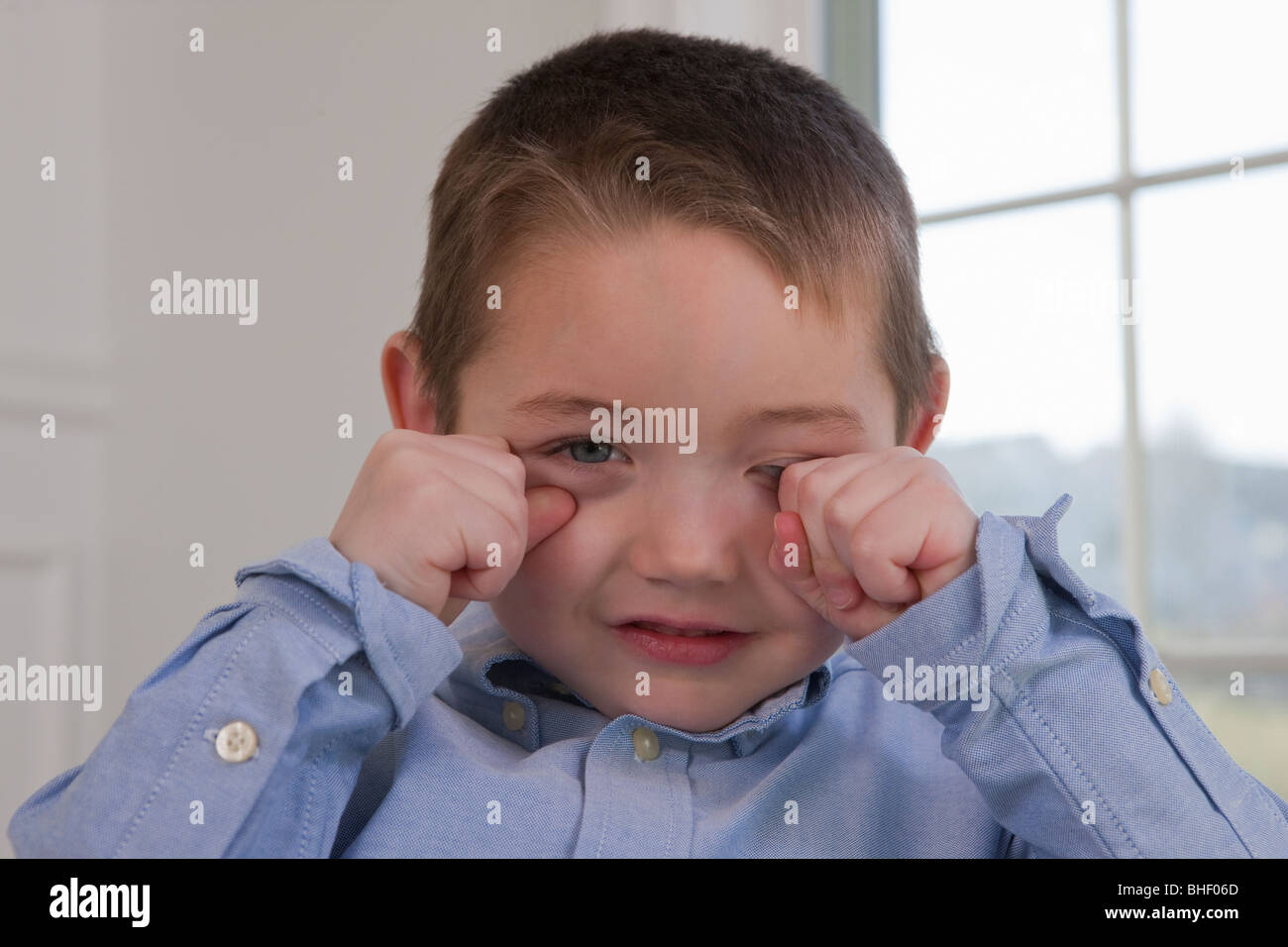 Boy signing the word 'Sleepy' in American Sign Language Stock Photo