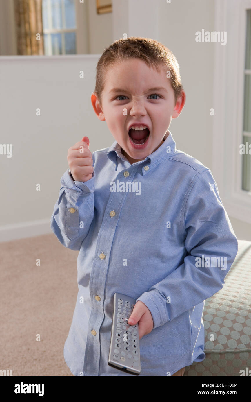 Boy signing the word 'Remote' in American Sign Language Stock Photo Alamy
