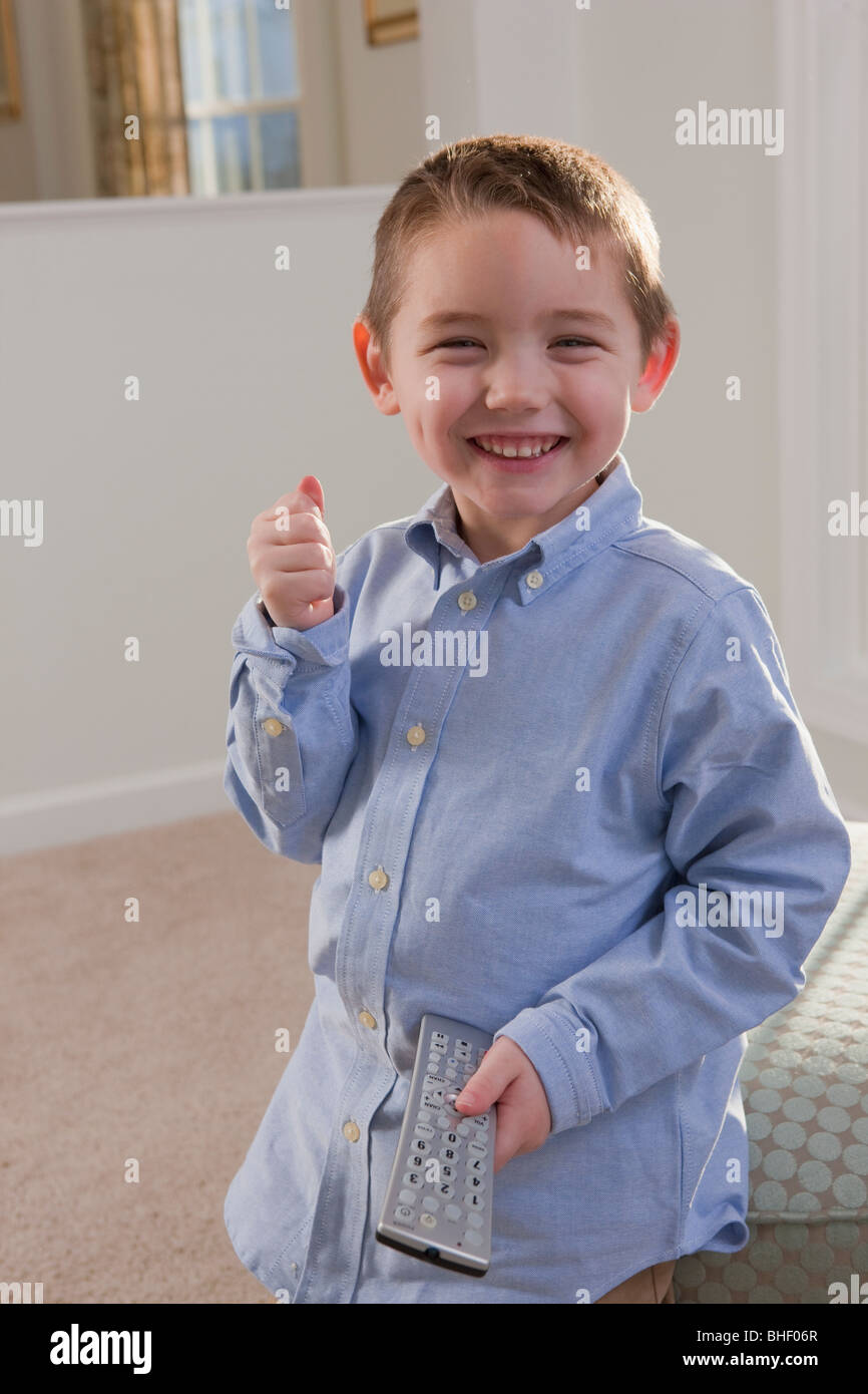 Boy signing the word 'Remote' in American Sign Language Stock Photo