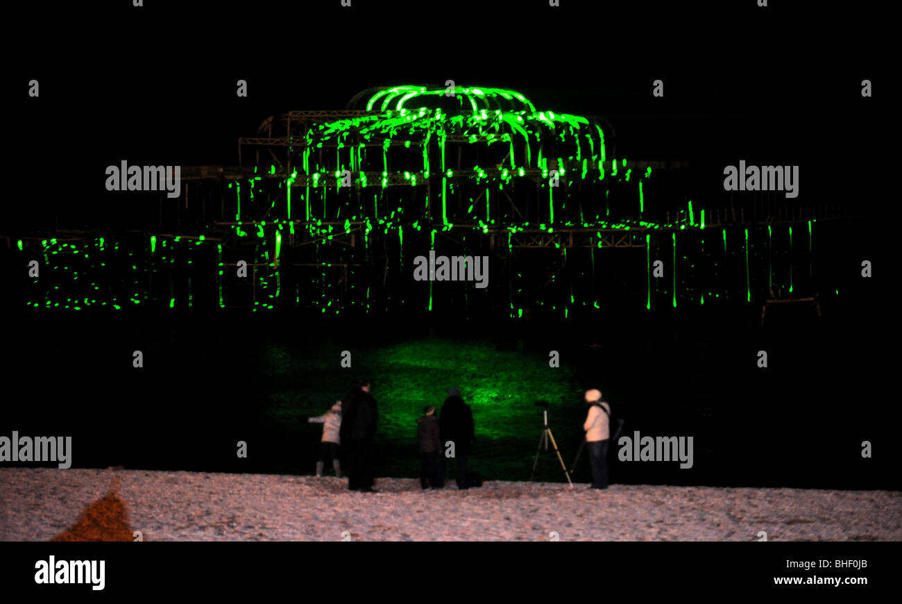 The West Pier in Brighton lit up by a laser show UK advertising Tiger Beer Stock Photo