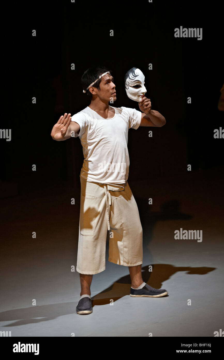 Actor on stage rehearsing with face mask. Thailand S. E. Asia Stock Photo