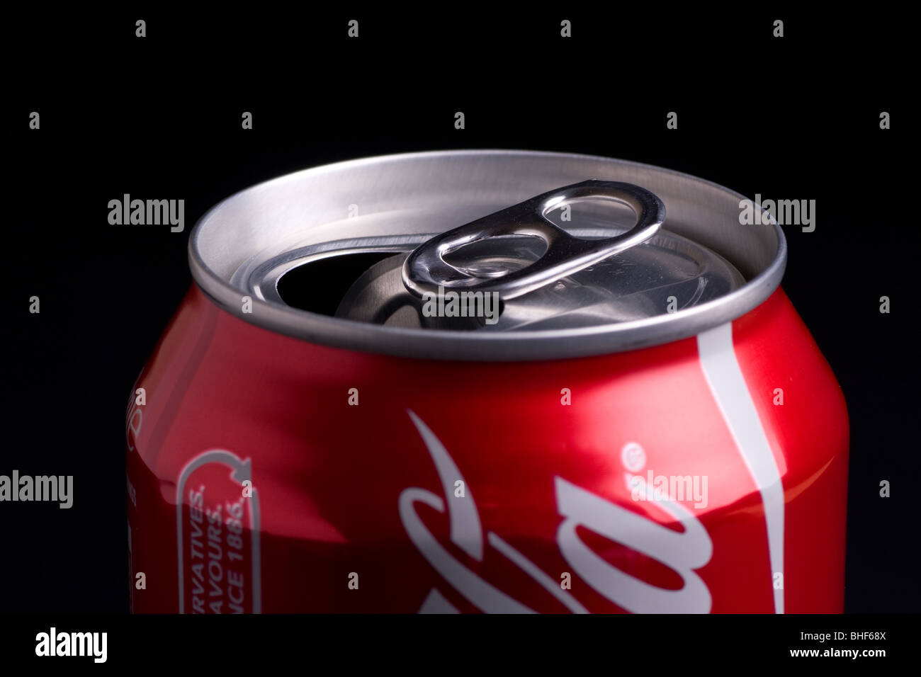Open coke a black background showing the ringpull Stock Photo Alamy