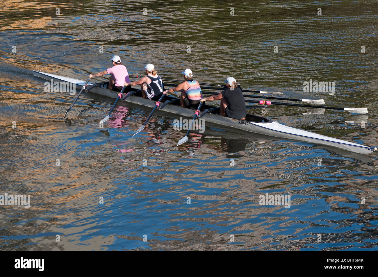A womans' fours rowing team training on the Yarra River in Melbourne Stock Photo