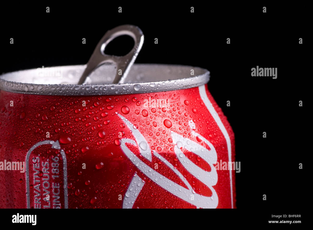Top of a coke can with beads of water showing the ringpull on a black background Stock Photo Alamy