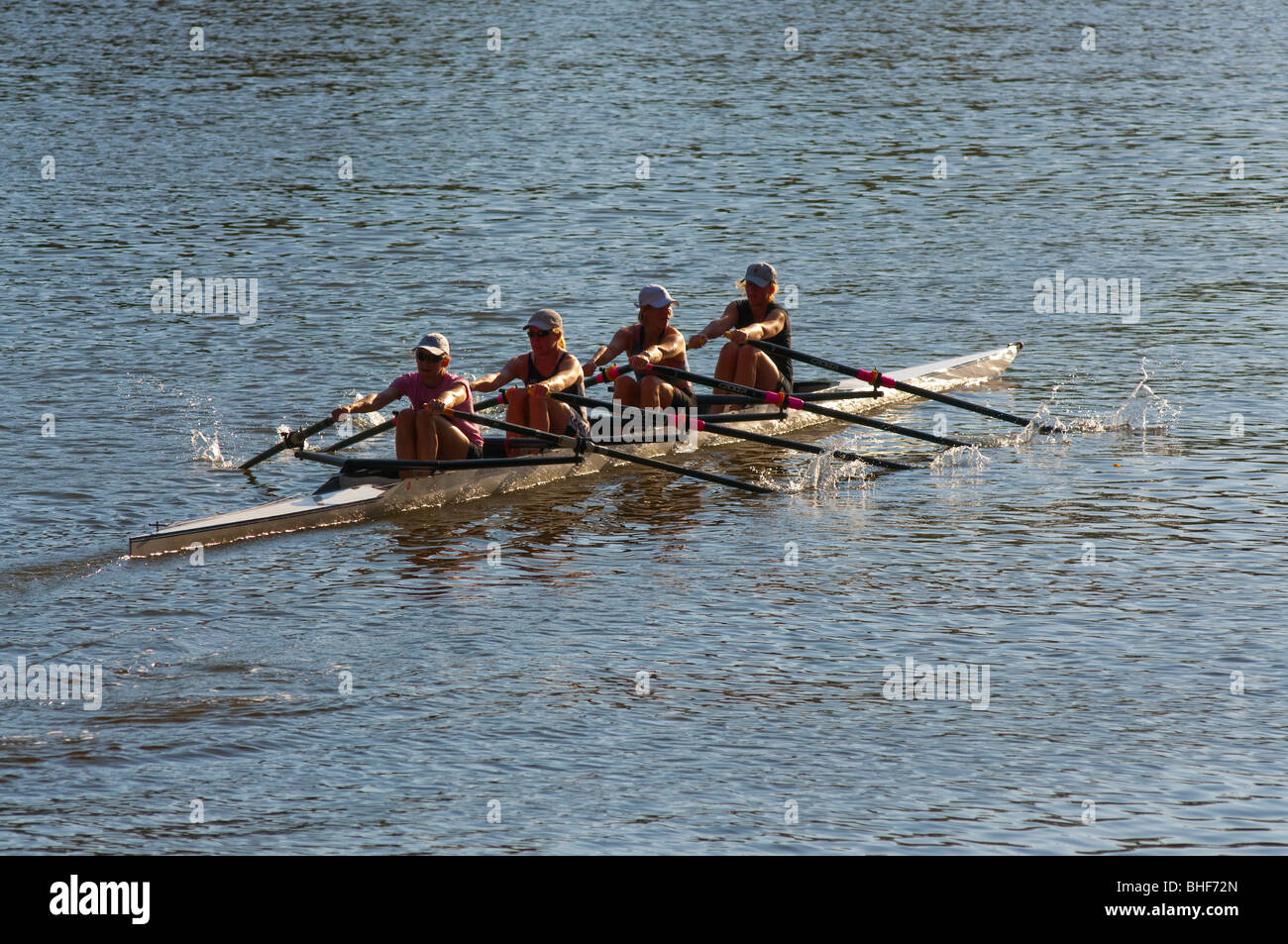 A womans' fours rowing team training on the Yarra River in Melbourne