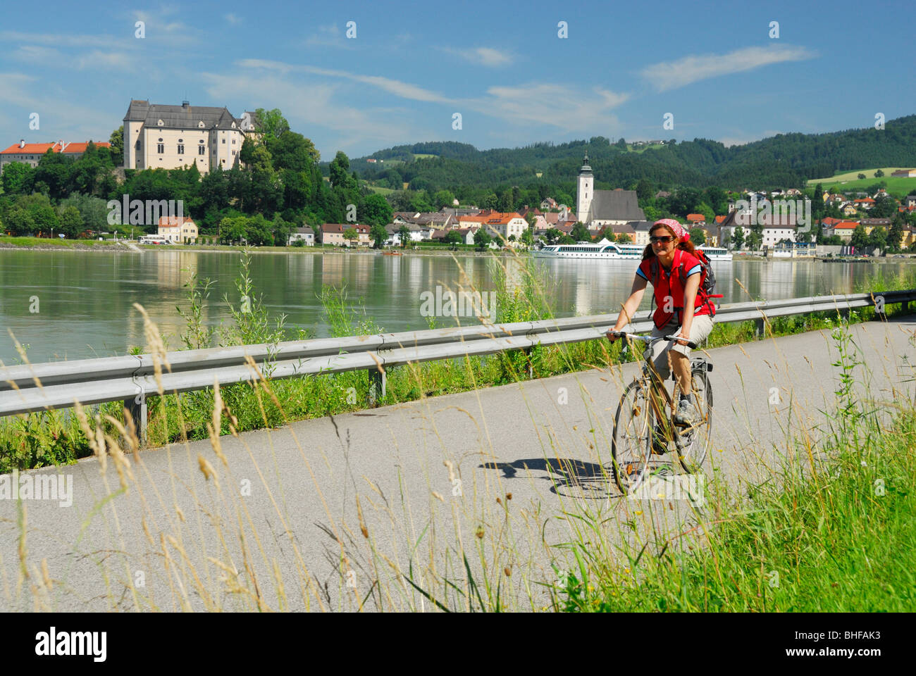 Female cyclist riding along Danube river, Danube Cycle Route Passau to  Vienna, Grein, Upper Austria, Austria Stock Photo - Alamy