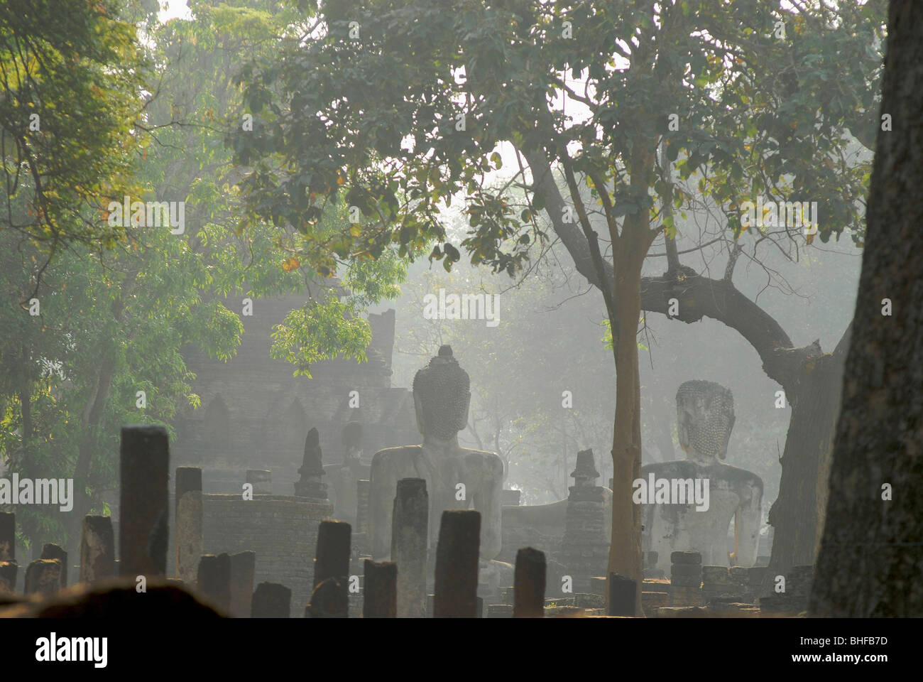 Buddha statues in the morning haze, Kamphaeng Phet, Wat Phra Khaeo, Central Thailand, Asia Stock Photo