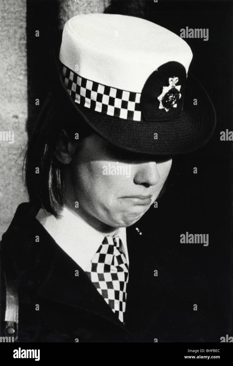 A policewoman sheds a tear on her cheek as she grieves at the funeral of Yvonne Fletcher, a police officer who was shot in 1984 Stock Photo