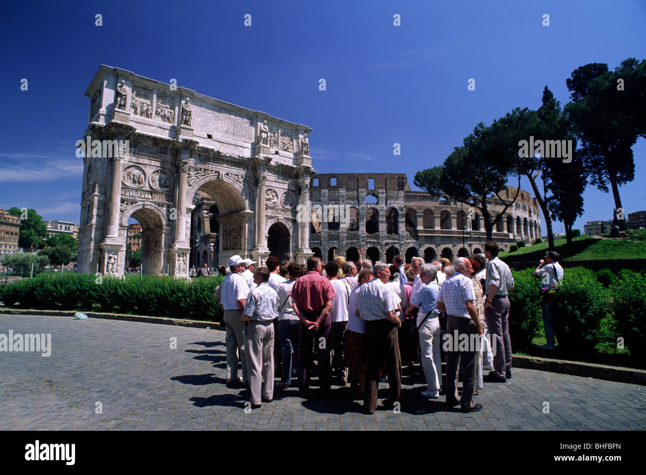 Italy, Rome, arch of Constantine and Colosseum, tourists Stock Photo