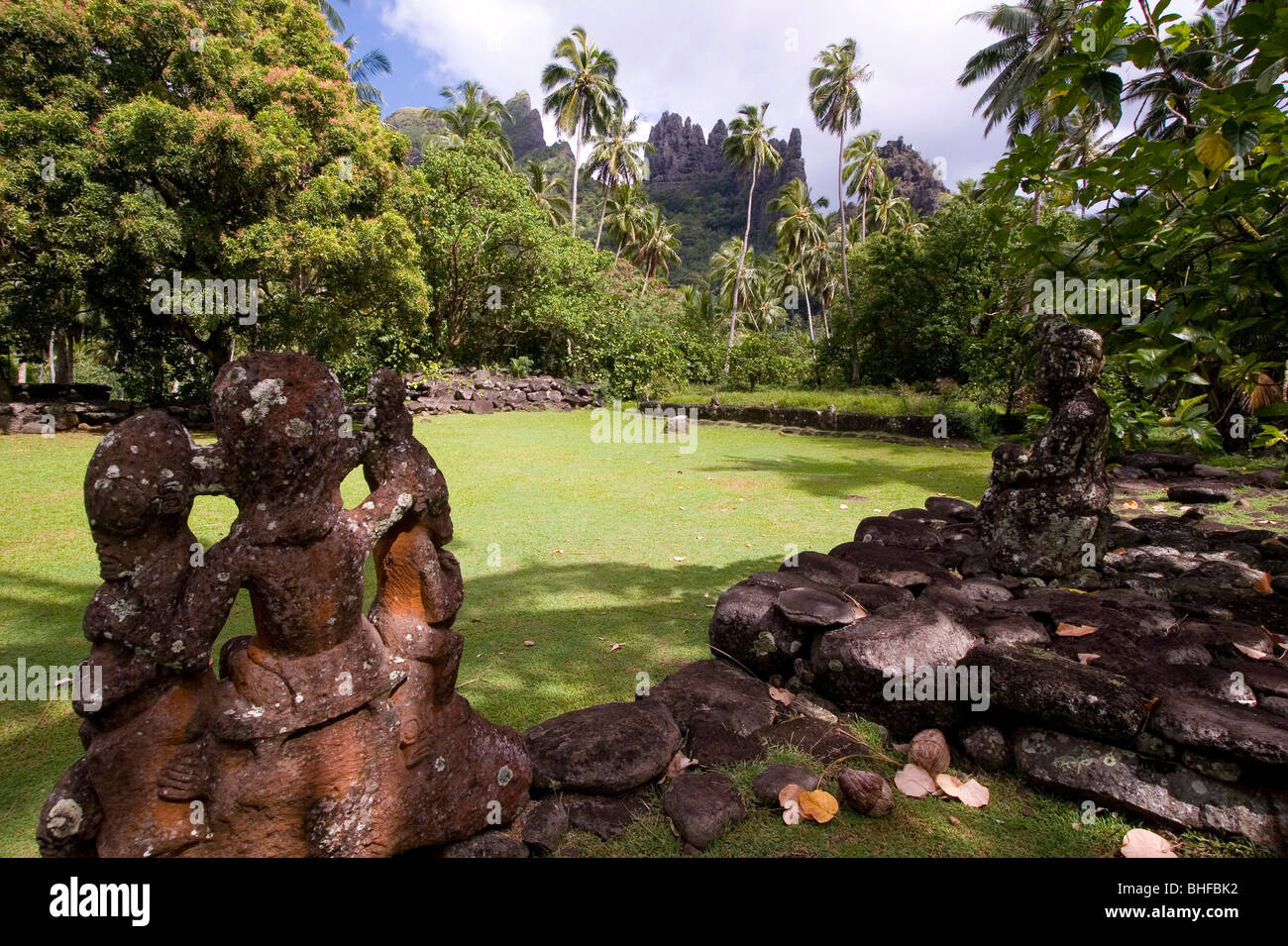 Weathered stone figure at a village, Pae Pae, Hatiheu Bay, Nuku Hiva, Marquesas, Polynesia, Oceania Stock Photo