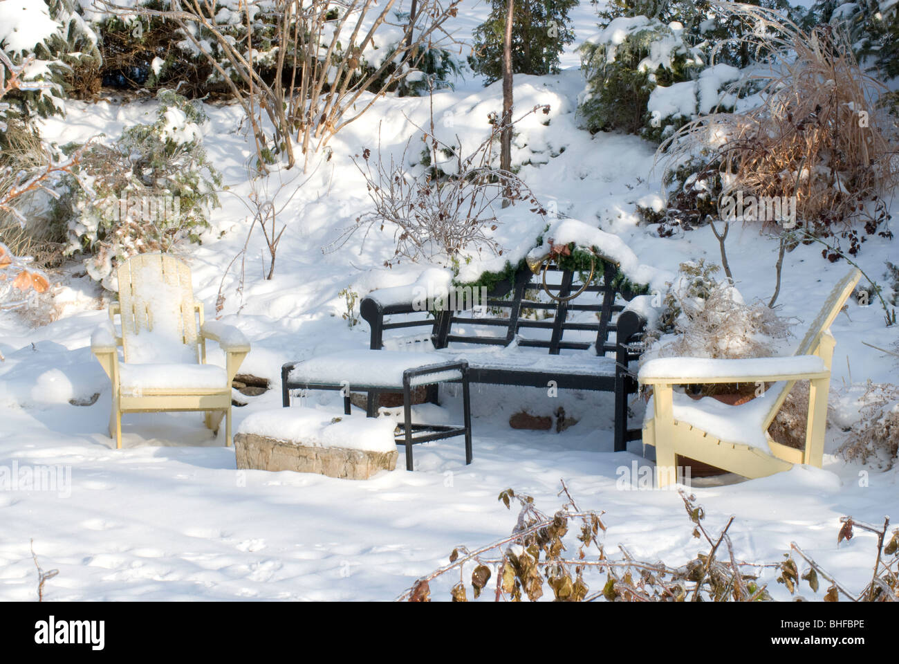 Lutyens Bench and Adirondack Chairs Garden in Winter Stock Photo