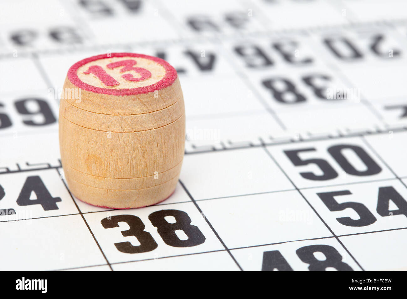 Wooden barrel lotto with a red number thirteen Stock Photo