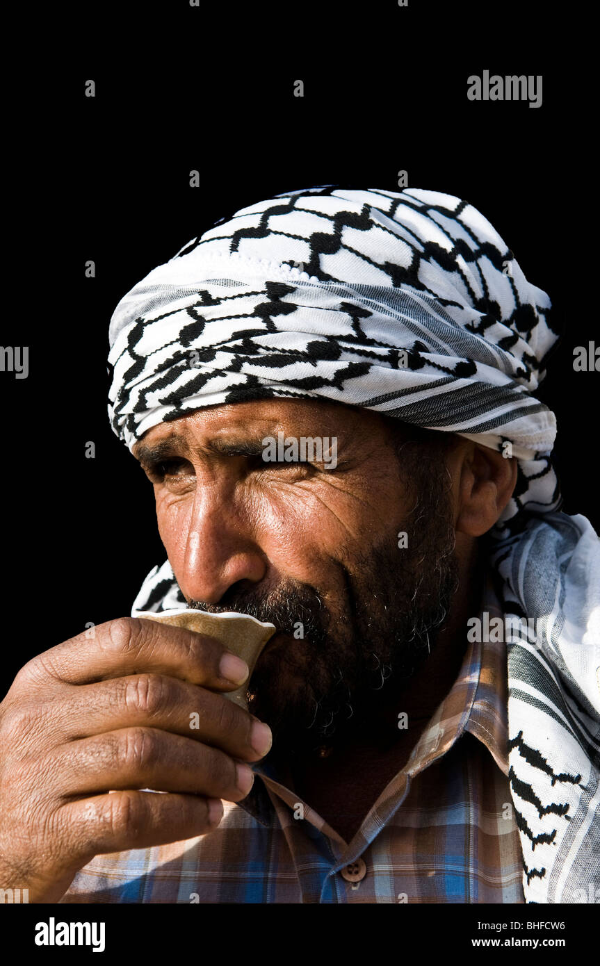 A Bedouin drinking traditional coffee. Stock Photo
