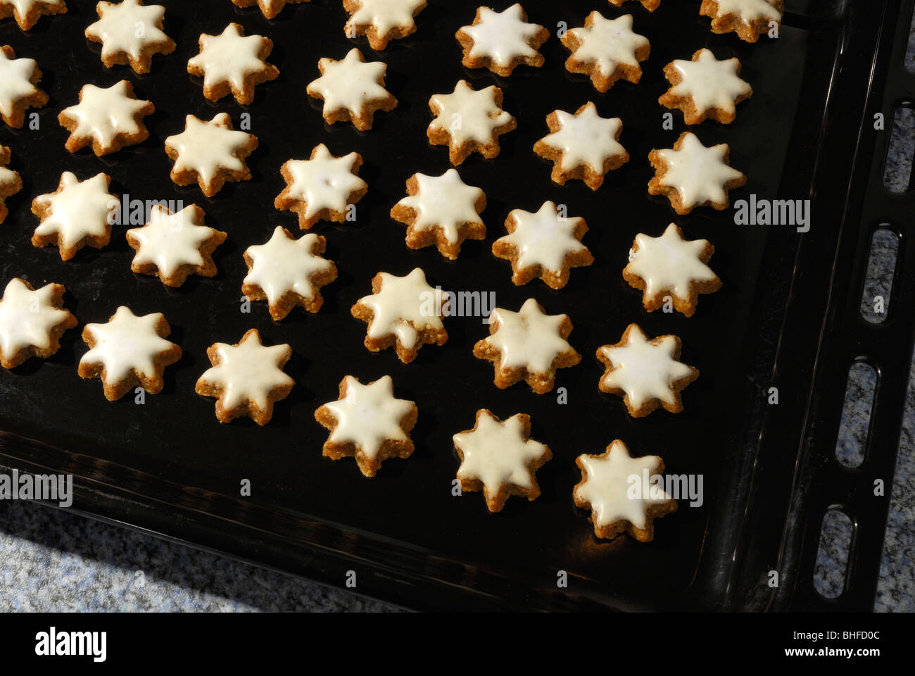 Baking tray with Christmas cookies cinnamon stars Stock Photo