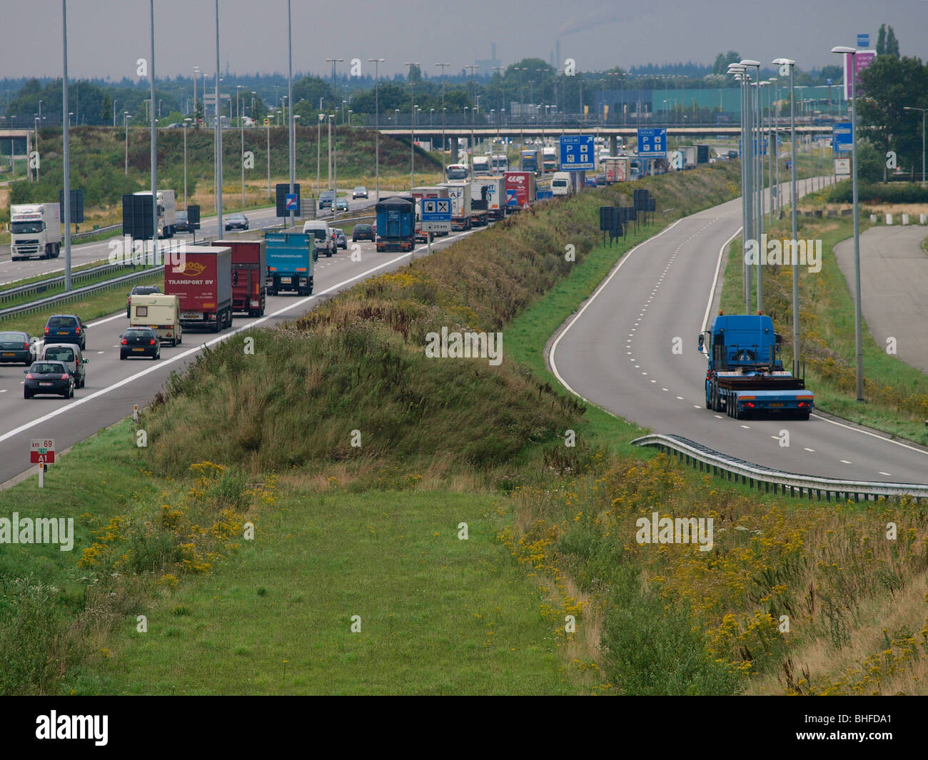 The Belgian E19 highway leading north, across the border into the Netherlands. Hazeldonk border zone. Stock Photo