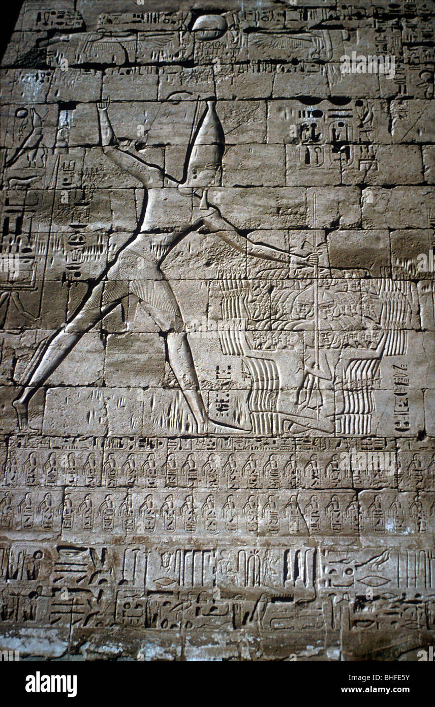 Relief of Rameses III smiting enemies, Mortuary Temple of Rameses III, Medinat Habu, c1200BC. Artist: Unknown Stock Photo