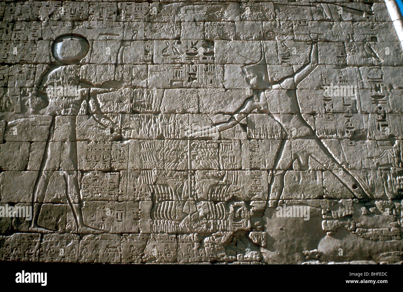 Rameses III smiting his enemies before Amun-Ra, Mortuary Temple, Medinat Habu, Egypt, c12th cen BC. Artist: Unknown Stock Photo