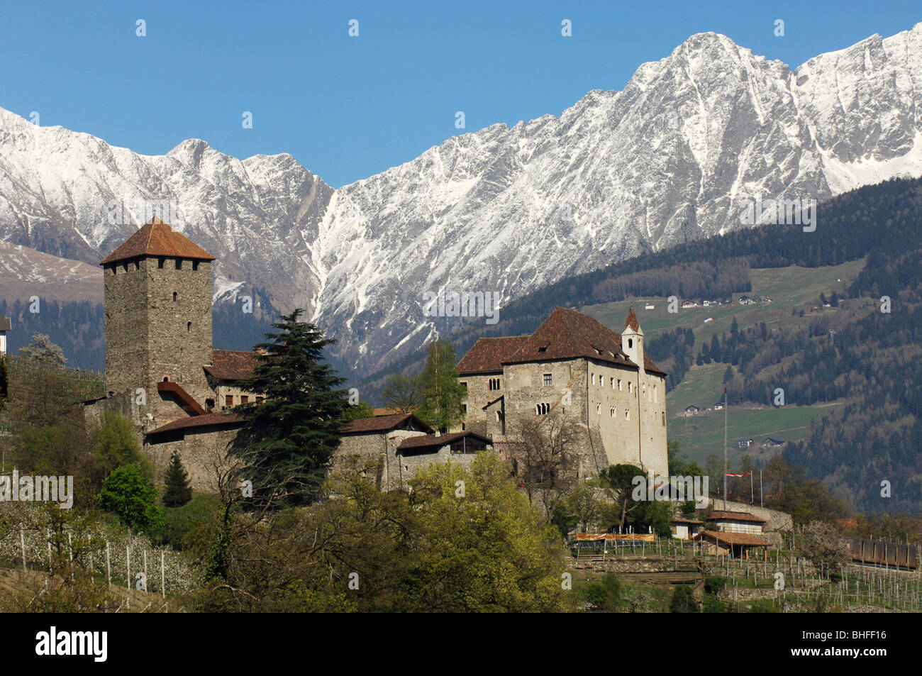 Tyrol castle in spring in front of snow covered mountains, Burggrafenamt, Etsch valley, South Tyrol, Italy, Europe Stock Photo