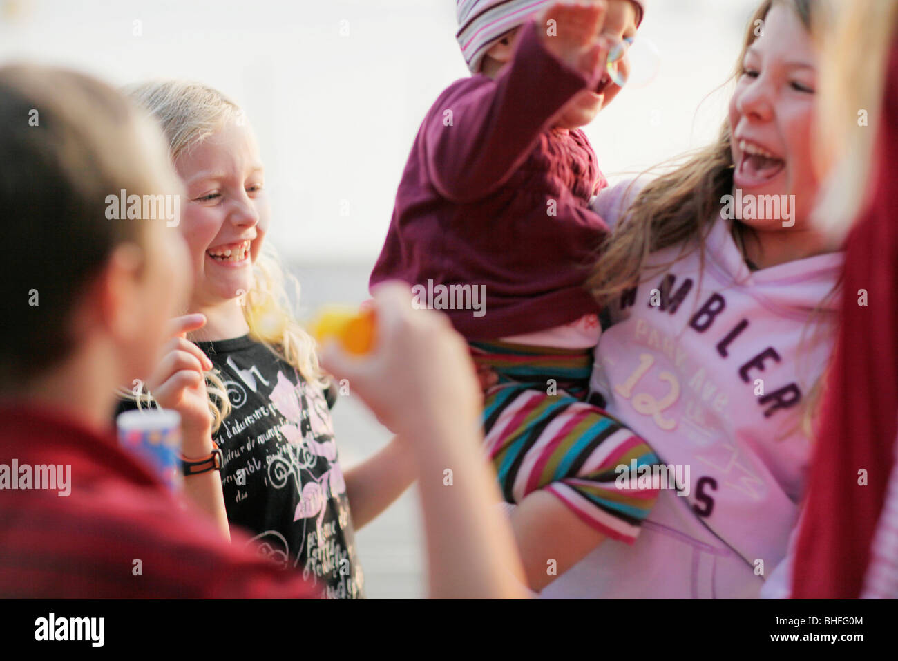 Laughing children, lake Worthsee, Bavaria, Germany Stock Photo