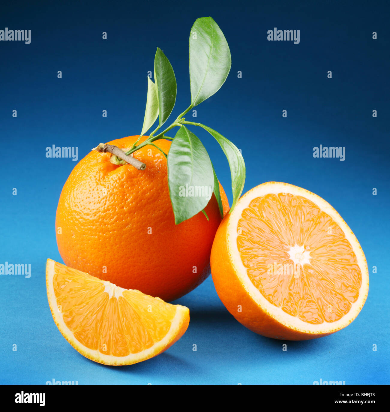 Ripe orange on a blue background Stock Photo