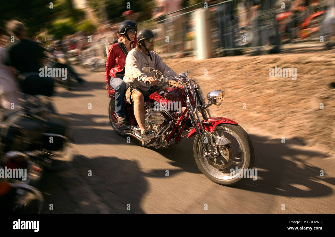 Riding a chopper motorcycle at speed. Stock Photo