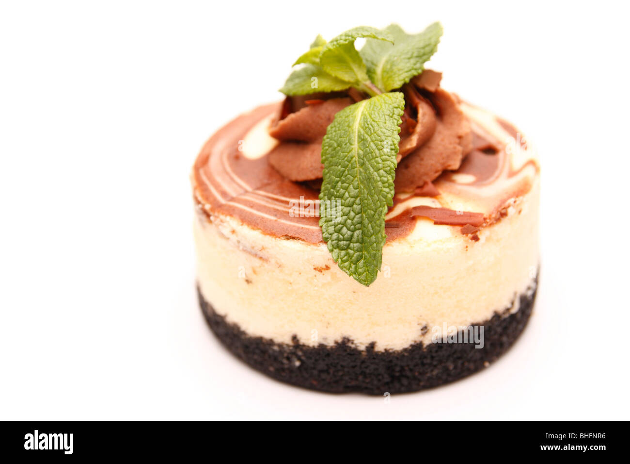 Mocha cheese cake with mint garnish on top Stock Photo Alamy