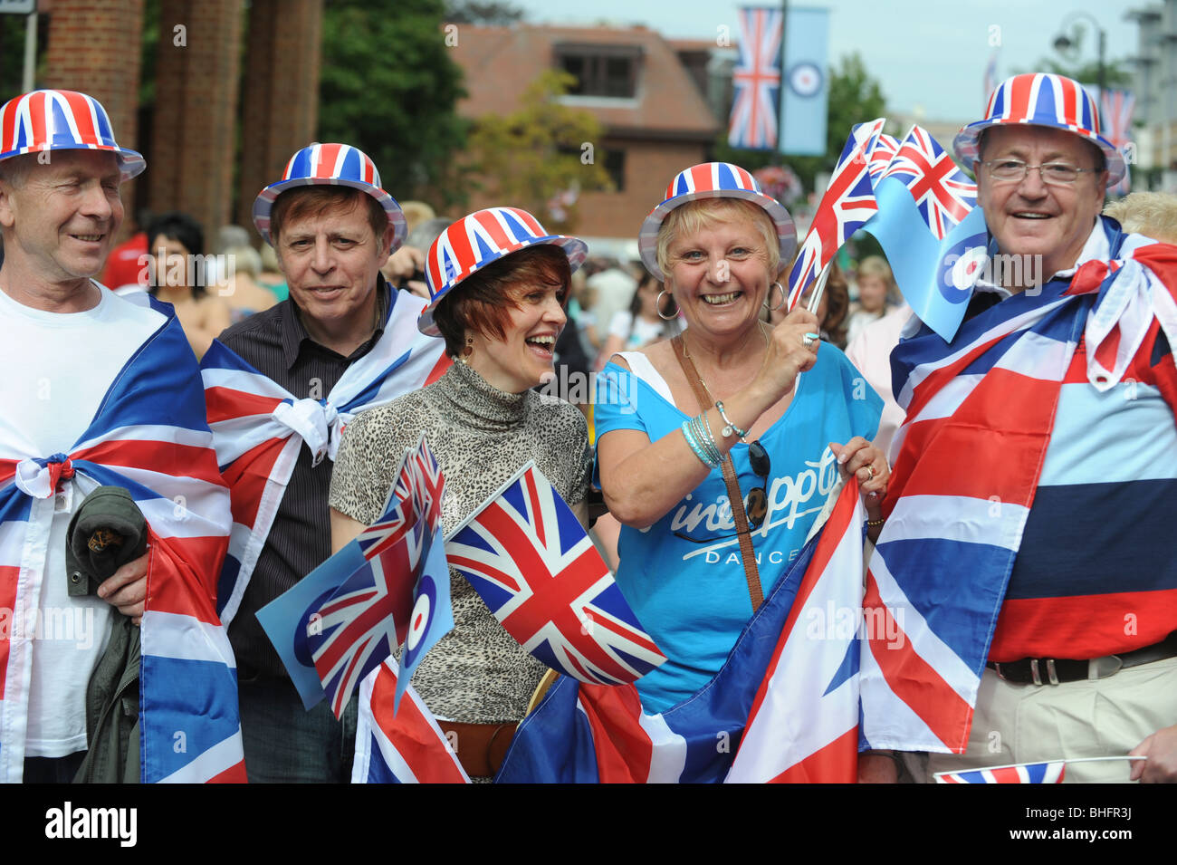 patriotic group with Union Jack flags and hats at parade to welcome British  military personnel back from Afghanistan Stock Photo - Alamy