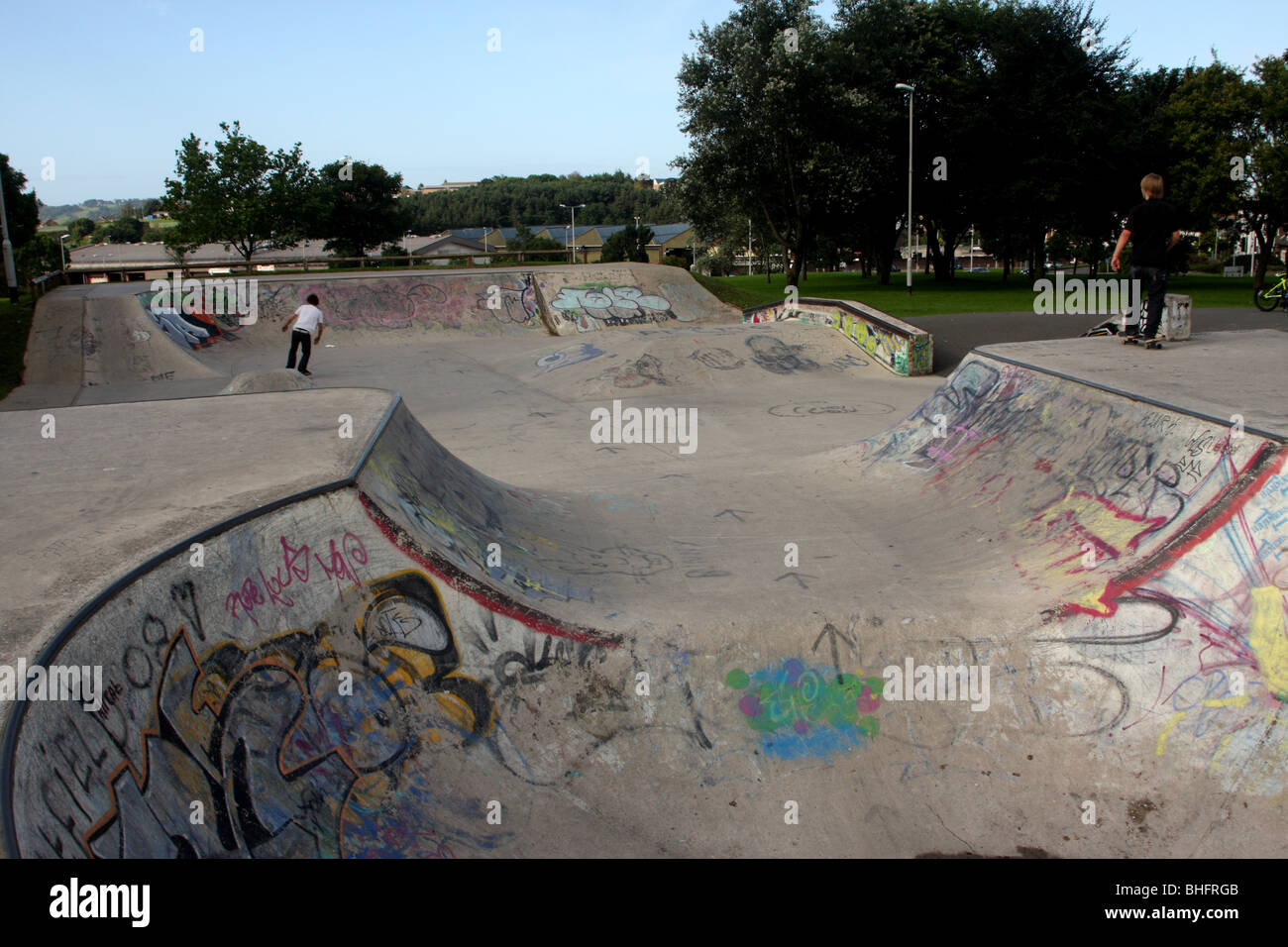 Urban skate park in use, in Central park, Plymouth, Devon, England, UK