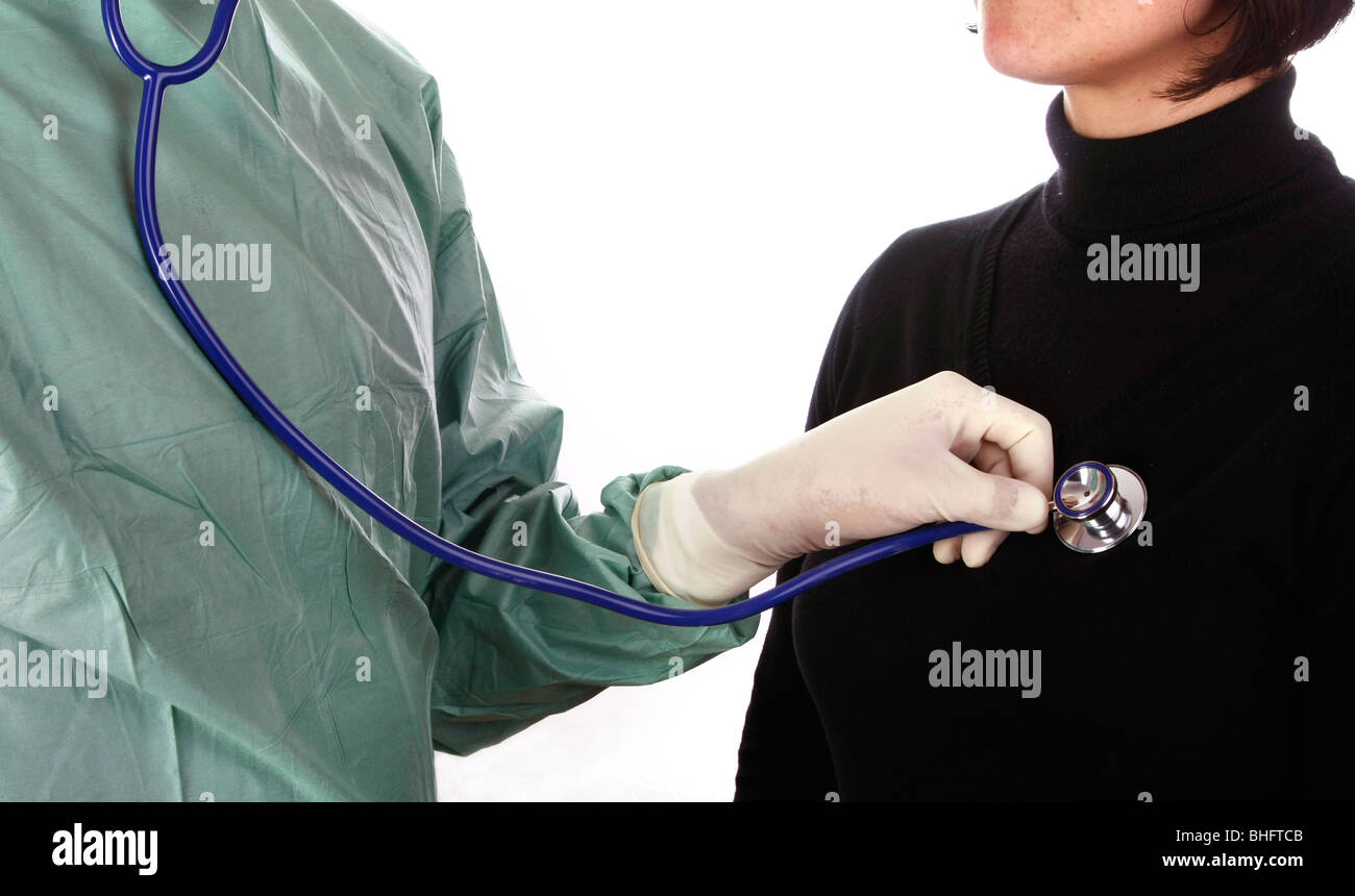 A doctor using a stethoscope on a patient Stock Photo - Alamy